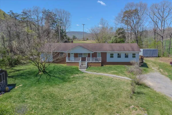a view of a house with a yard