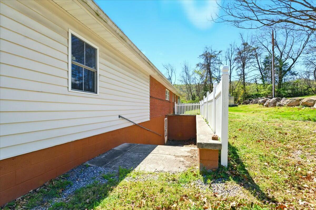 2351 Reese Mountain Road Elliston, VA 24087 - Photo 29 of 57 a backyard of a house with table and chairs