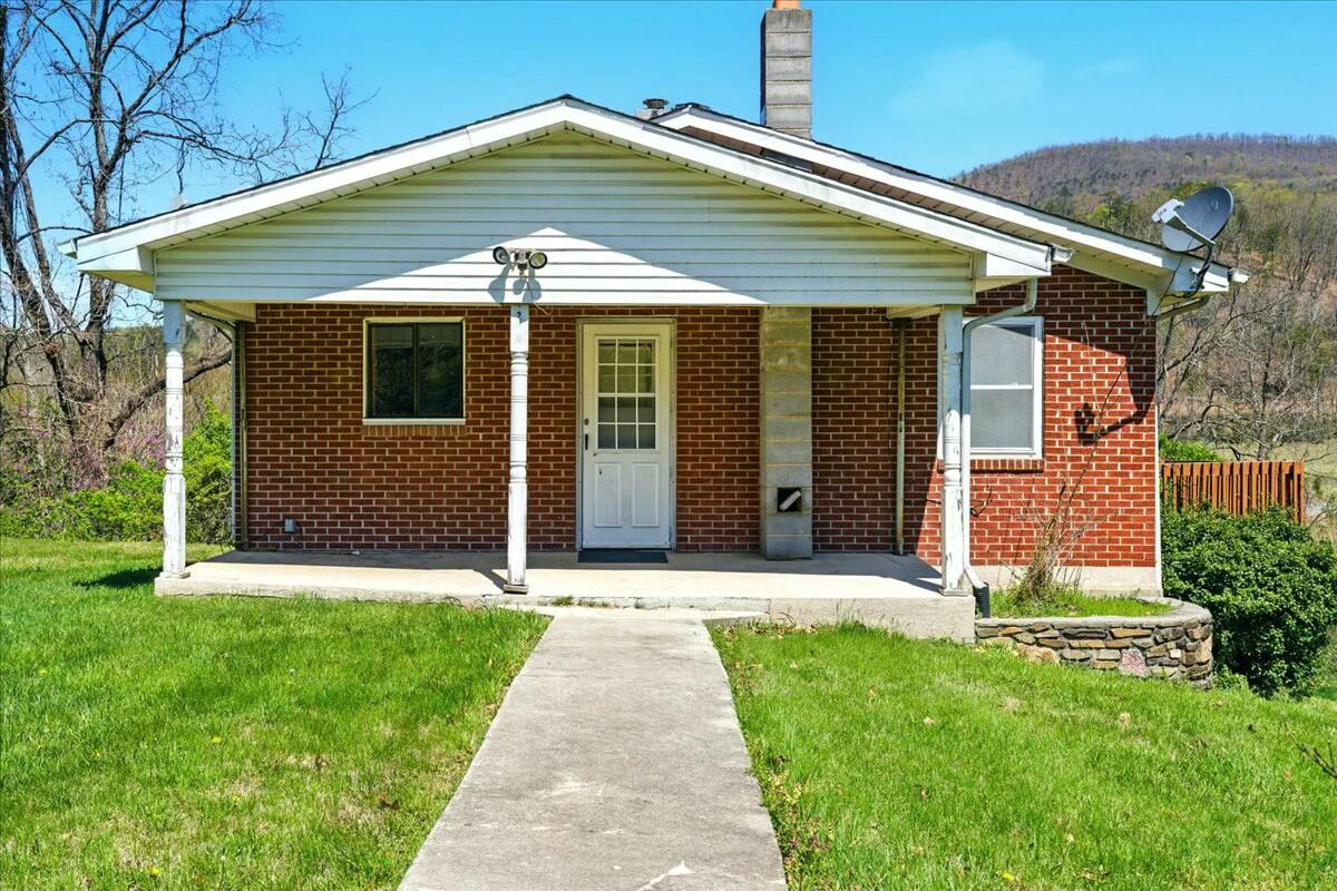 2351 Reese Mountain Road Elliston, VA 24087 - Photo 33 of 57 a front view of a house with a yard