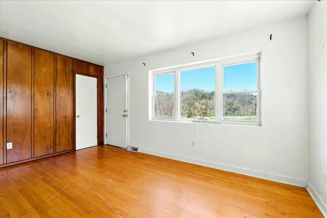 a bathroom with a sink toilet and mirror