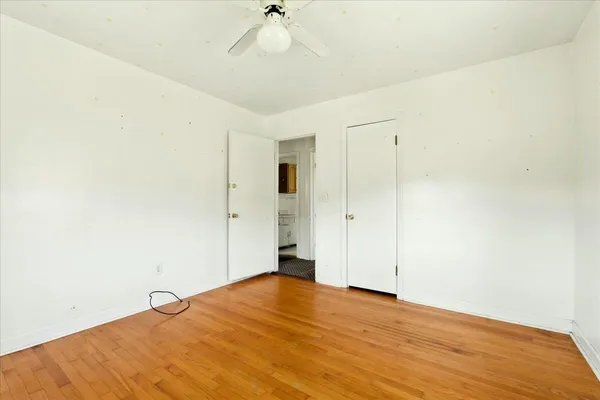 a backyard of a house with a yard and outdoor seating