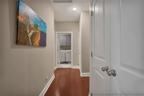 a view of a room that has a bed in it