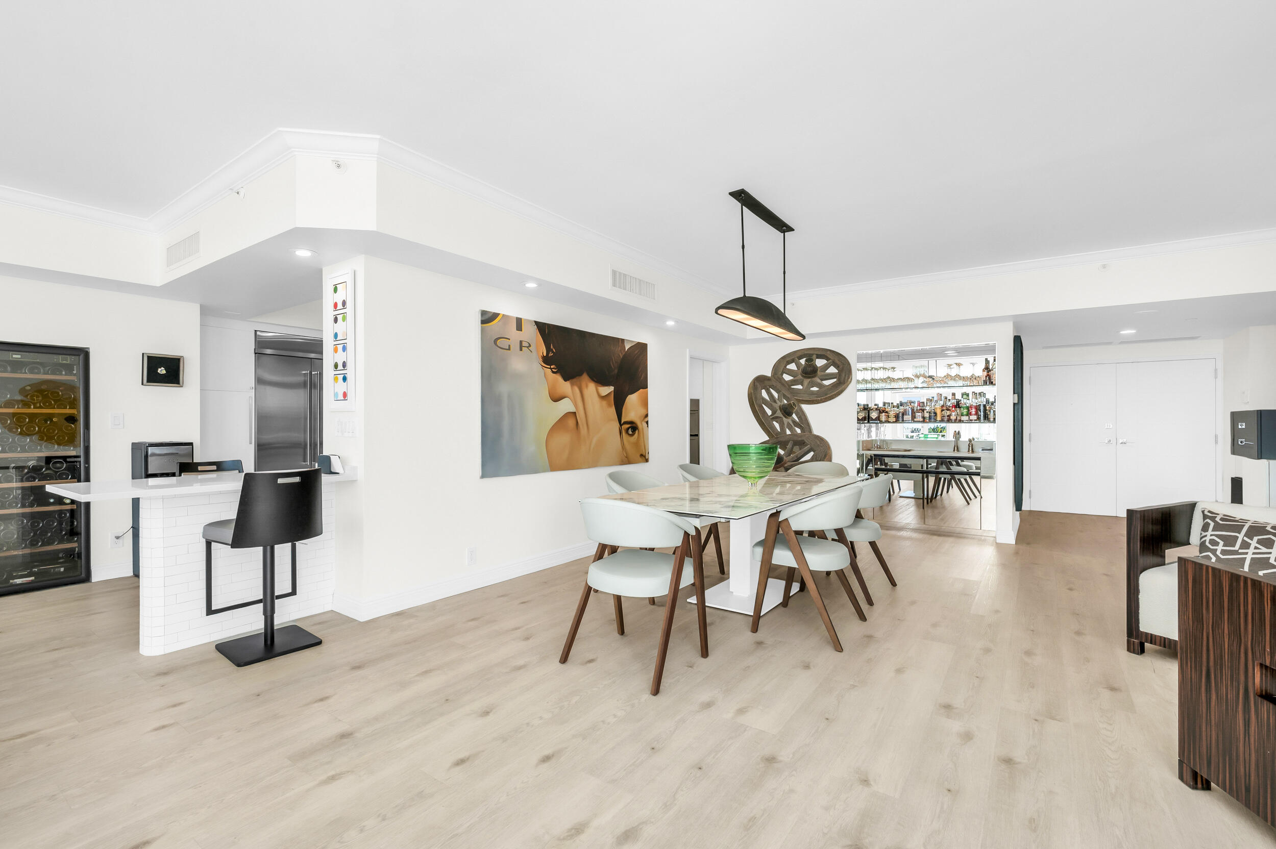 300 Southeast 5th Avenue, Unit 6110 Boca Raton, FL 33432 - Photo 15 of 96 a dining room with furniture entryway and wooden floor