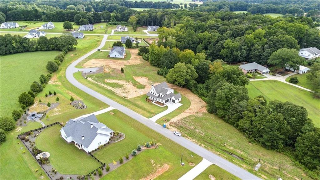 95 Old Town Road Dacula, GA 30019 - Photo 69 of 74 an aerial view of a house with a garden and swimming pool