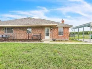 a front view of a house with yard