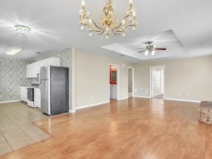 a view of a kitchen with a sink and cabinets