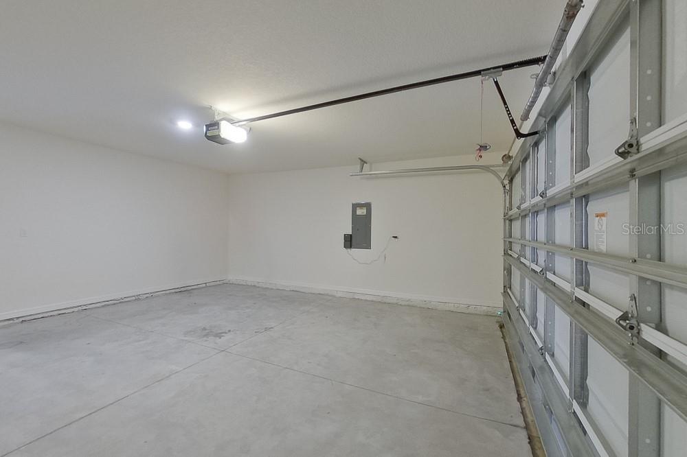 4397 Southwest 85th Lane Ocala, FL 34476 - Photo 21 of 23 en empty room with stairs and wooden floor