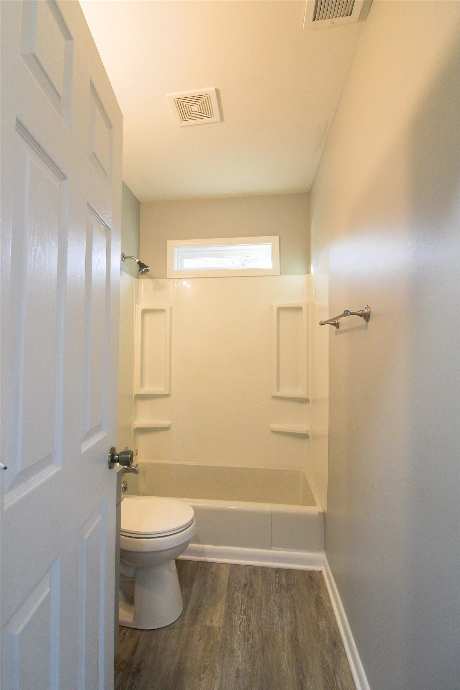 284 Highland Street Ripley, TN 38063 - Photo 14 of 23 Bathroom featuring bathing tub / shower combination and dark wood-style flooring