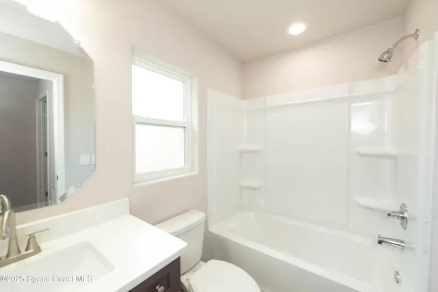 a bathroom with a sink toilet bathtub and vanity