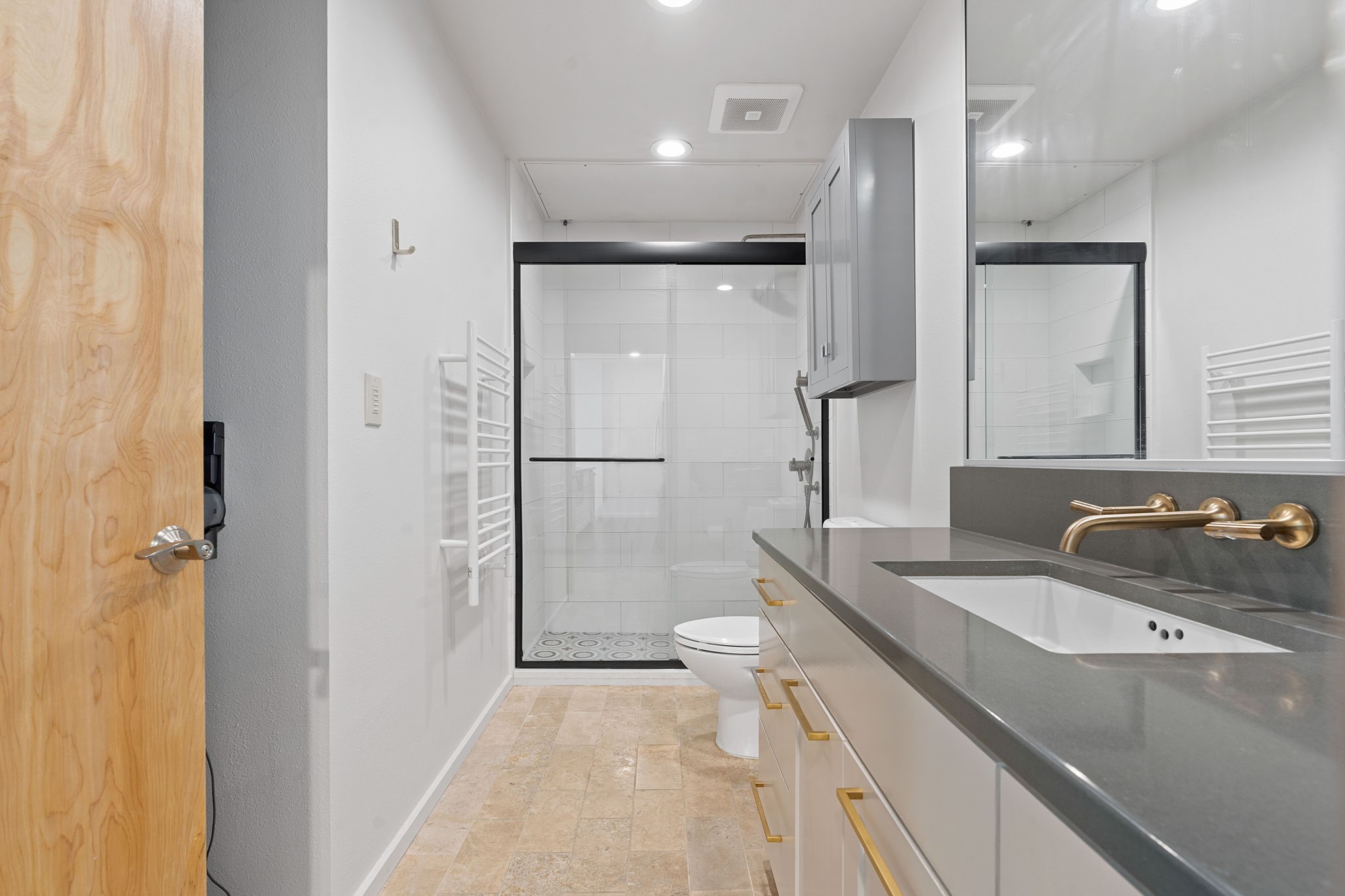 1600 Barton Springs Road, Unit 2102 Austin, TX 78704 - Photo 17 of 37 a bathroom with a sink double vanity and a mirror