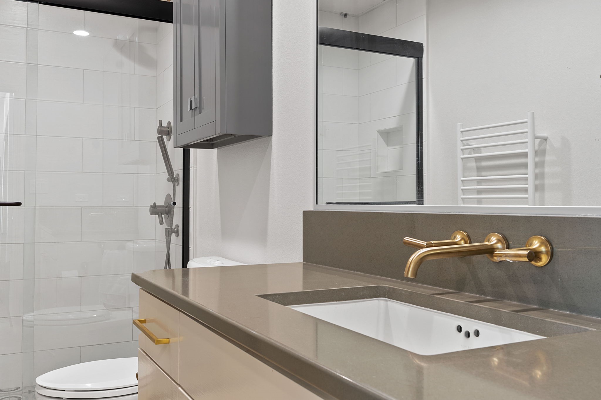 1600 Barton Springs Road, Unit 2102 Austin, TX 78704 - Photo 19 of 37 a bathroom with a sink and a mirror