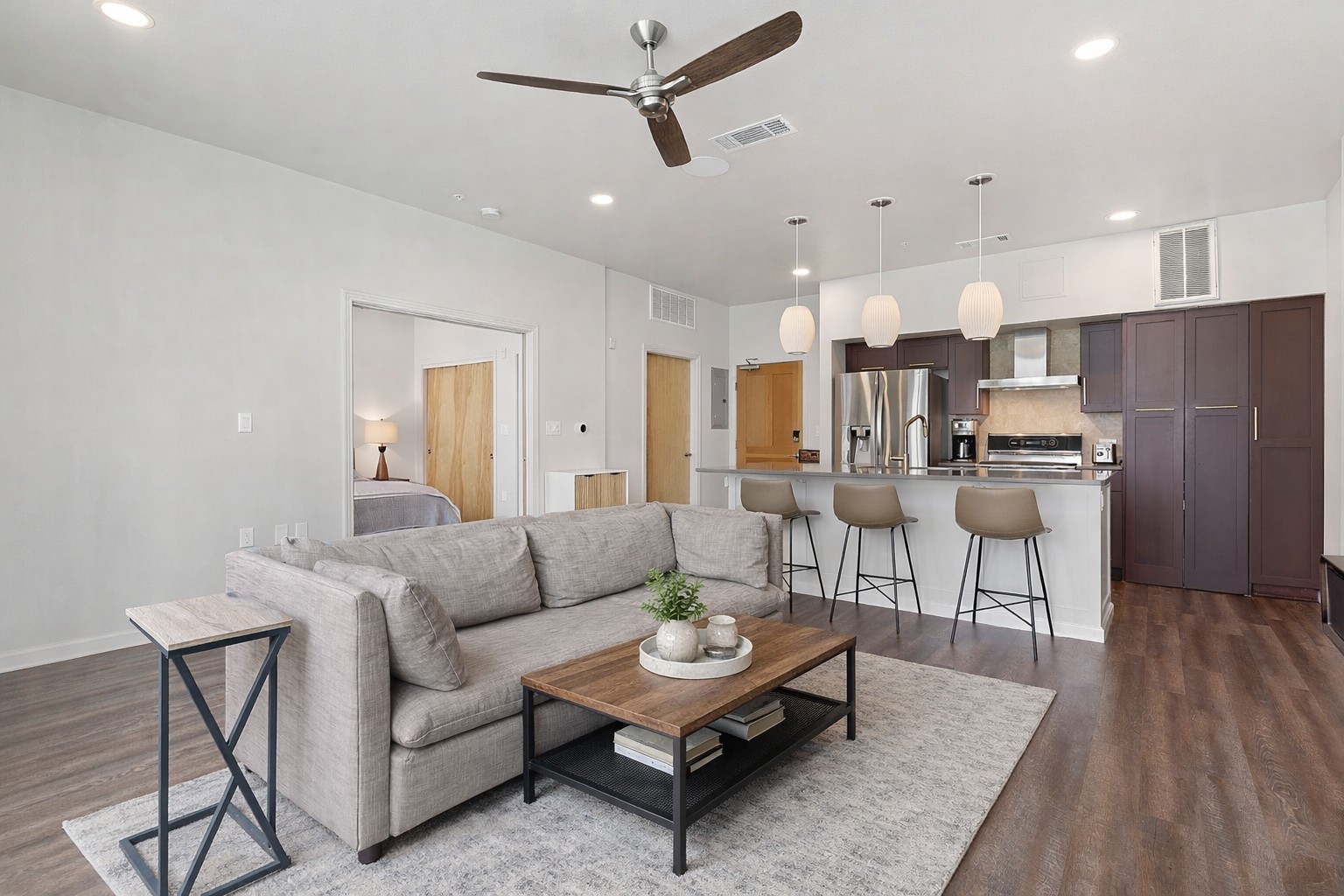 1600 Barton Springs Road, Unit 2102 Austin, TX 78704 - Photo 5 of 37 a living room with furniture and kitchen view