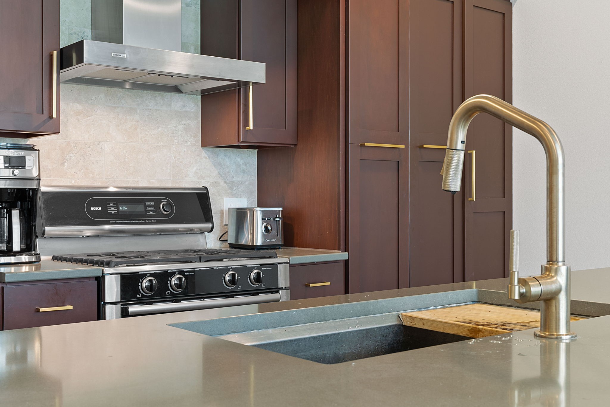 1600 Barton Springs Road, Unit 2102 Austin, TX 78704 - Photo 9 of 37 a kitchen with stainless steel appliances granite countertop a stove a sink and a microwave