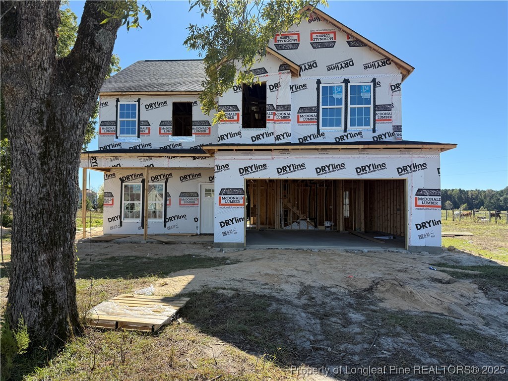 2070 Canady Pond Road Hope Mills, NC 28348 - Photo 1 of 6 a front view of a house with a yard