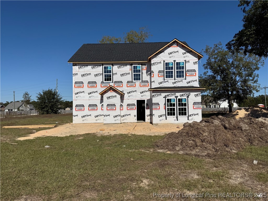 2070 Canady Pond Road Hope Mills, NC 28348 - Photo 6 of 6 a front view of a house with a yard