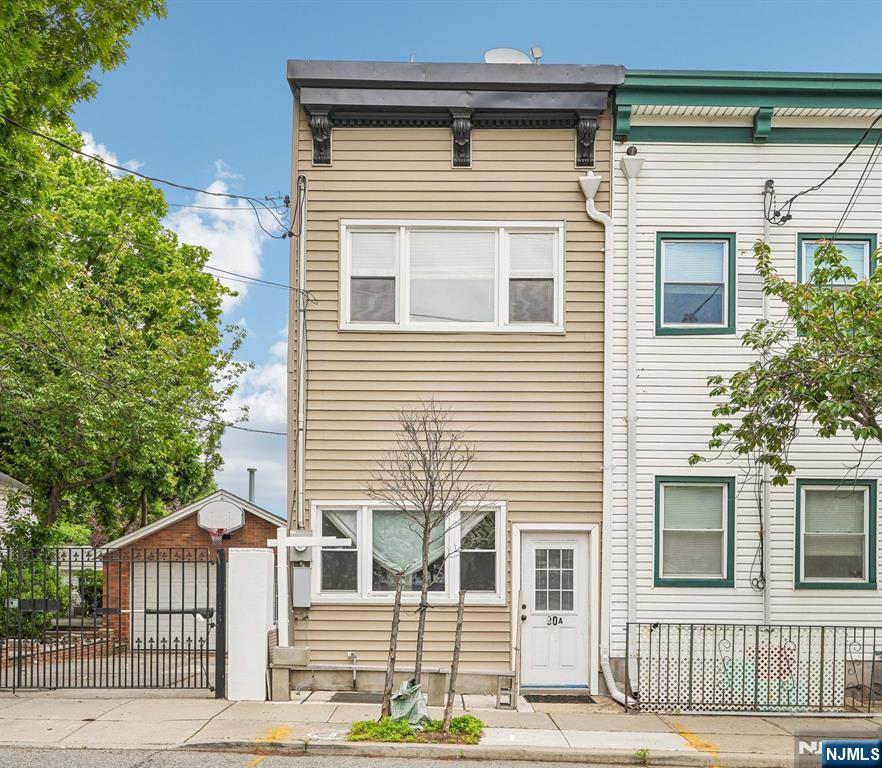 90 A Hackensack Plank Road Weehawken, NJ 07086 - Photo 2 of 40 a front view of a house with a garage