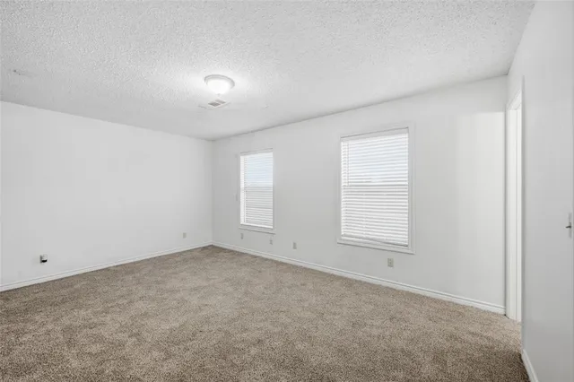 an empty room with a empty space and a window