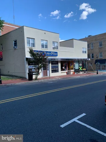 a living room with stainless steel appliances kitchen island granite countertop furniture and a kitchen view