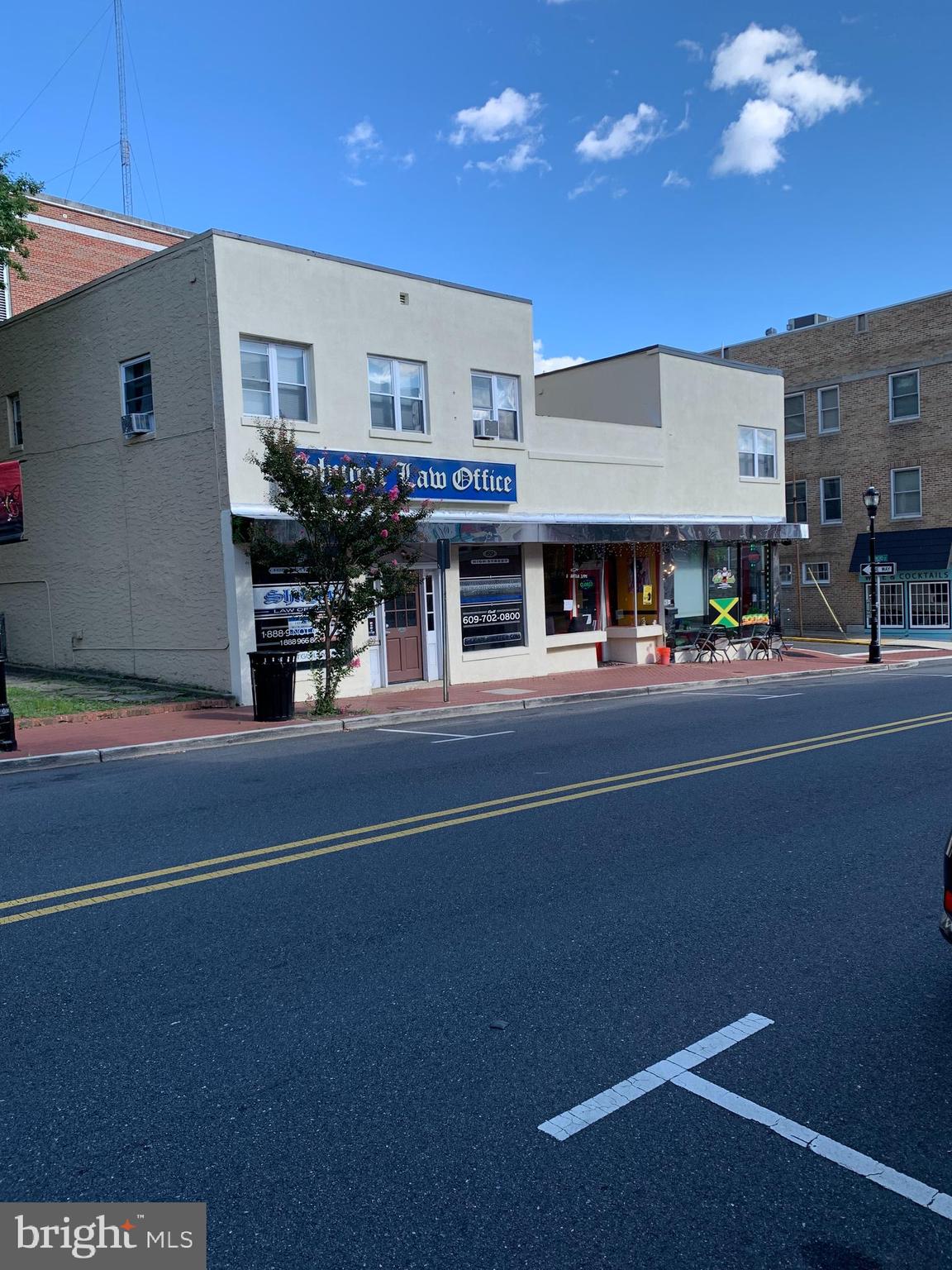 a living room with stainless steel appliances kitchen island granite countertop furniture and a kitchen view