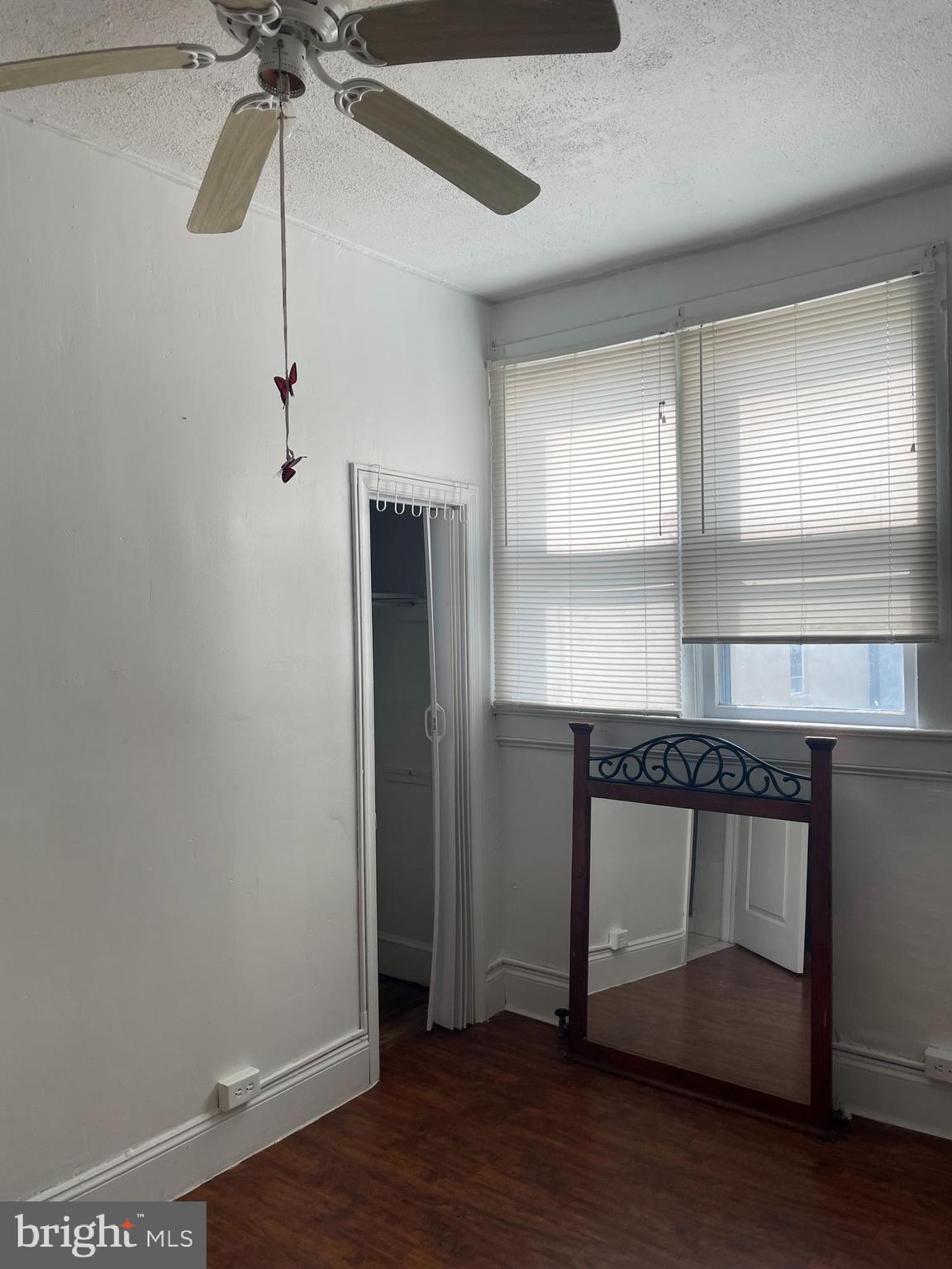 65-69 High Street, Unit 1 Mount Holly, NJ 08060 - Photo 3 of 5 a room with a hardwood and ceiling fan