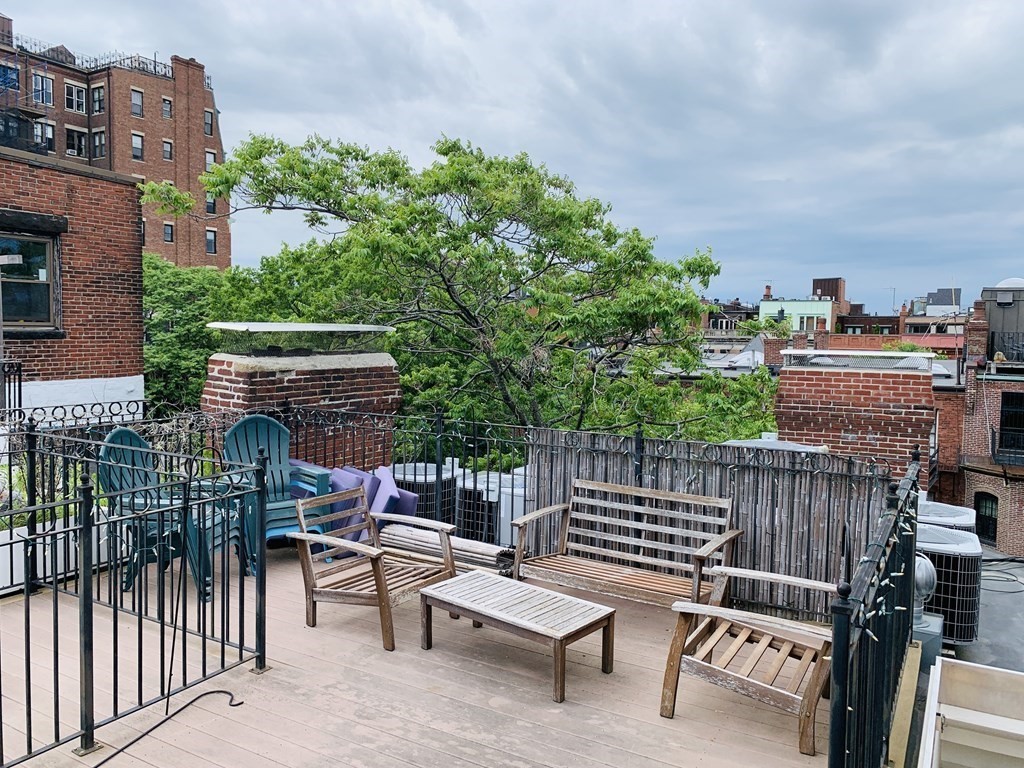 395 Marlborough Street, Unit 8 Boston, MA 02115 - Photo 17 of 19 a view of a chairs and tables in the back yard of the house