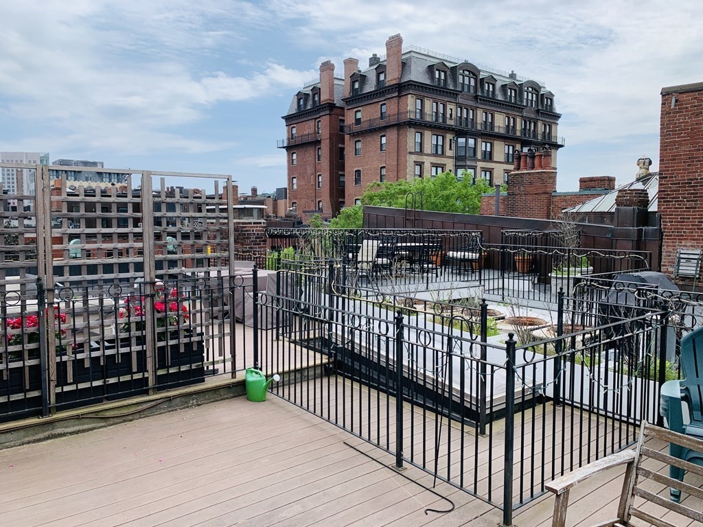 395 Marlborough Street, Unit 8 Boston, MA 02115 - Photo 19 of 19 a view of a balcony with wooden fence