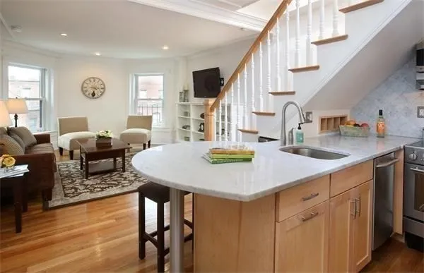 a view of kitchen and dining room with wooden floor