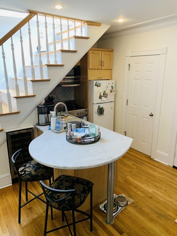 395 Marlborough Street, Unit 8 Boston, MA 02115 - Photo 8 of 19 a view of a dining room with furniture and wooden floor