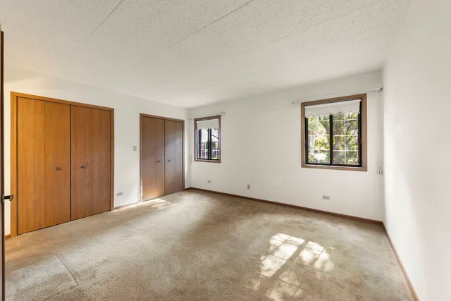 a bathroom with a toilet a sink a mirror a bathtub and vanity