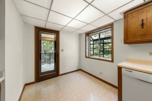 a kitchen with a stove sink and cabinets