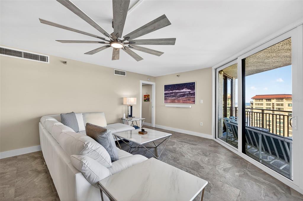 690 Island Way, Unit 1109 Clearwater Beach, FL 33767 - Photo 13 of 37 a living room with furniture and a ceiling fan