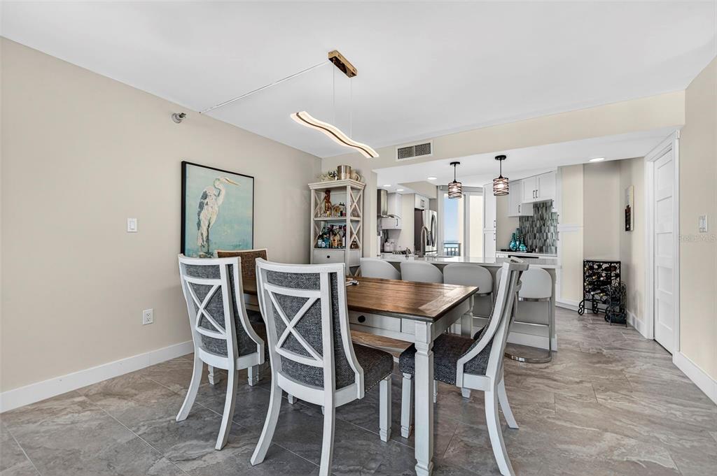 690 Island Way, Unit 1109 Clearwater Beach, FL 33767 - Photo 14 of 37 a view of a dining room with furniture