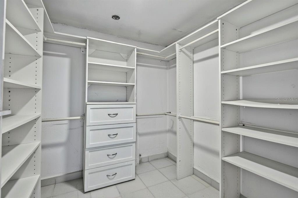 690 Island Way, Unit 1109 Clearwater Beach, FL 33767 - Photo 20 of 37 a view of an empty walk in closet