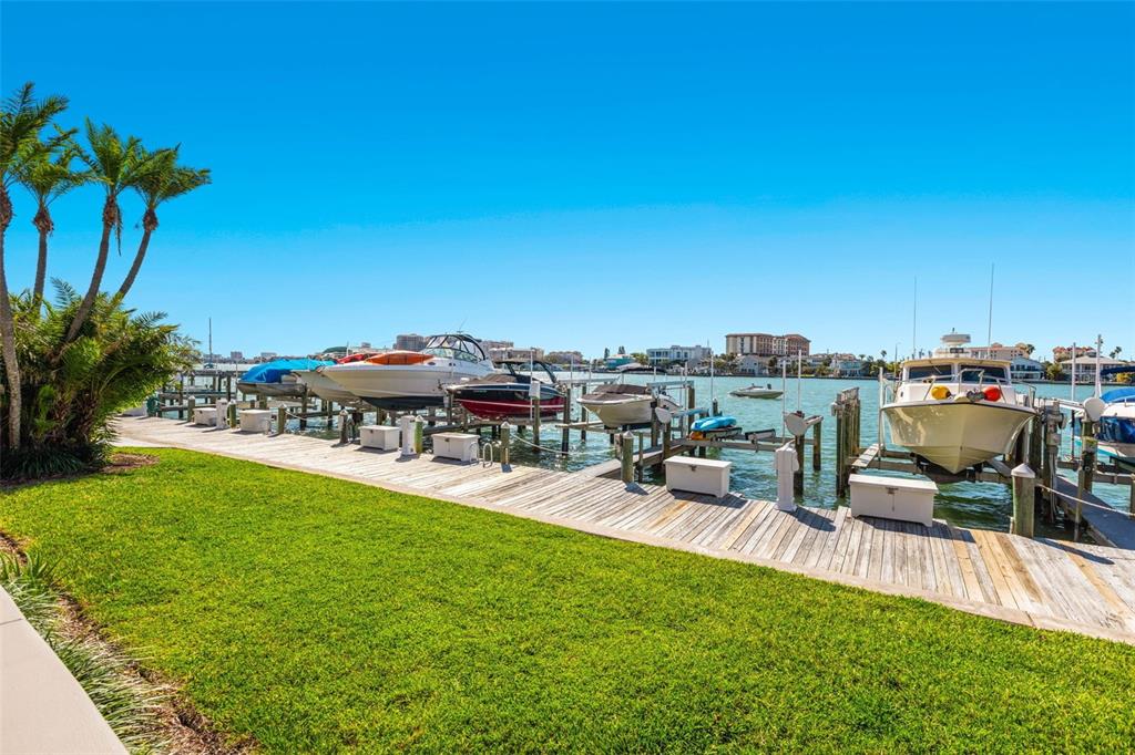 690 Island Way, Unit 1109 Clearwater Beach, FL 33767 - Photo 33 of 37 a view of a chairs and table in the patio