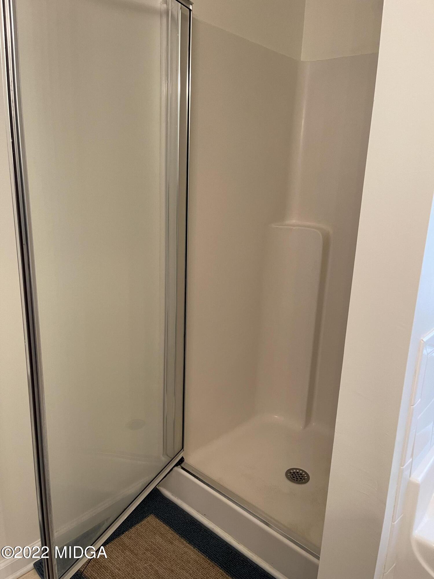 90 Hickory Road Jackson, GA 30233 - Photo 19 of 19 a bathroom with a glass door