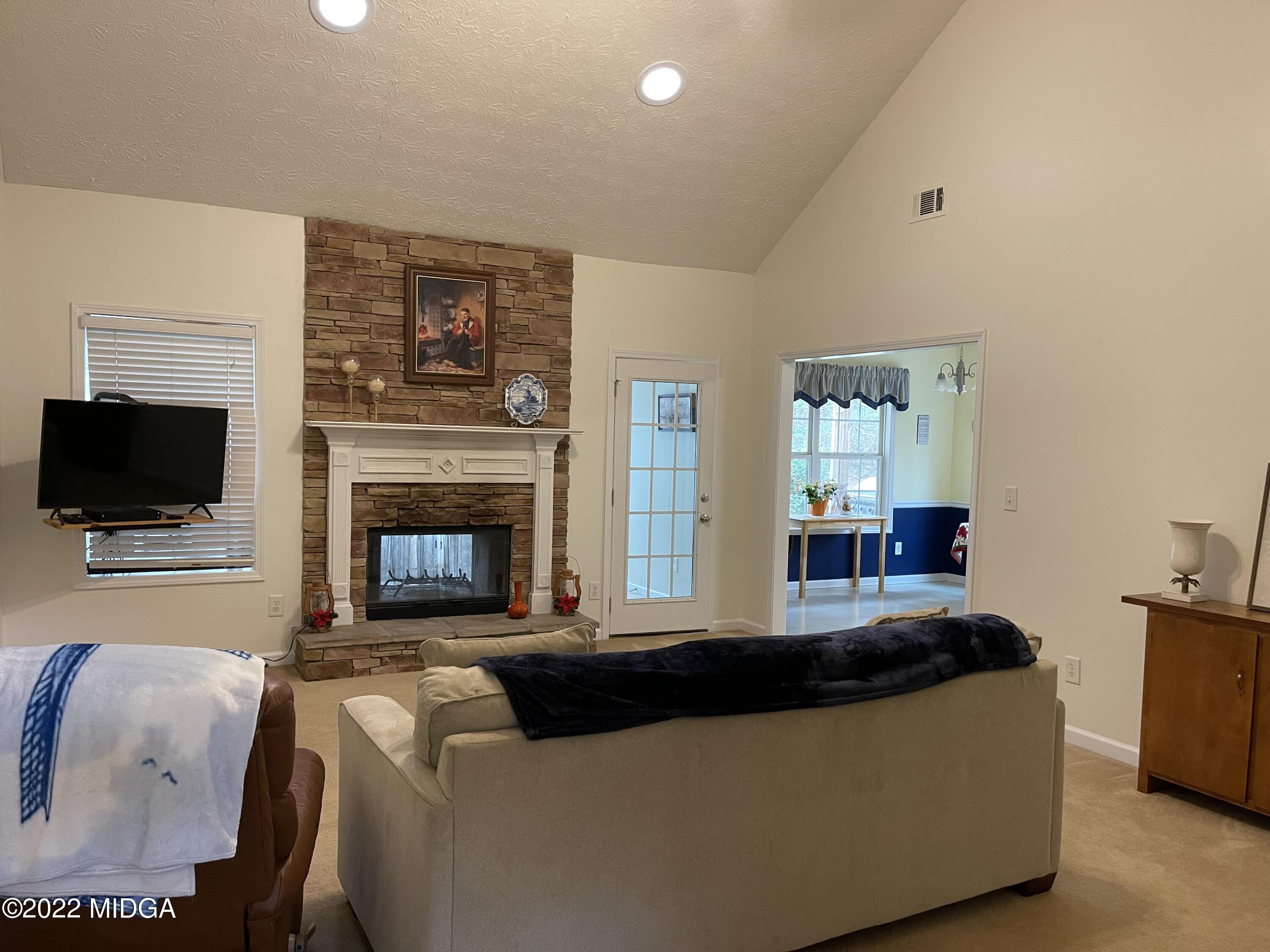 90 Hickory Road Jackson, GA 30233 - Photo 3 of 19 a living room with furniture and a fireplace