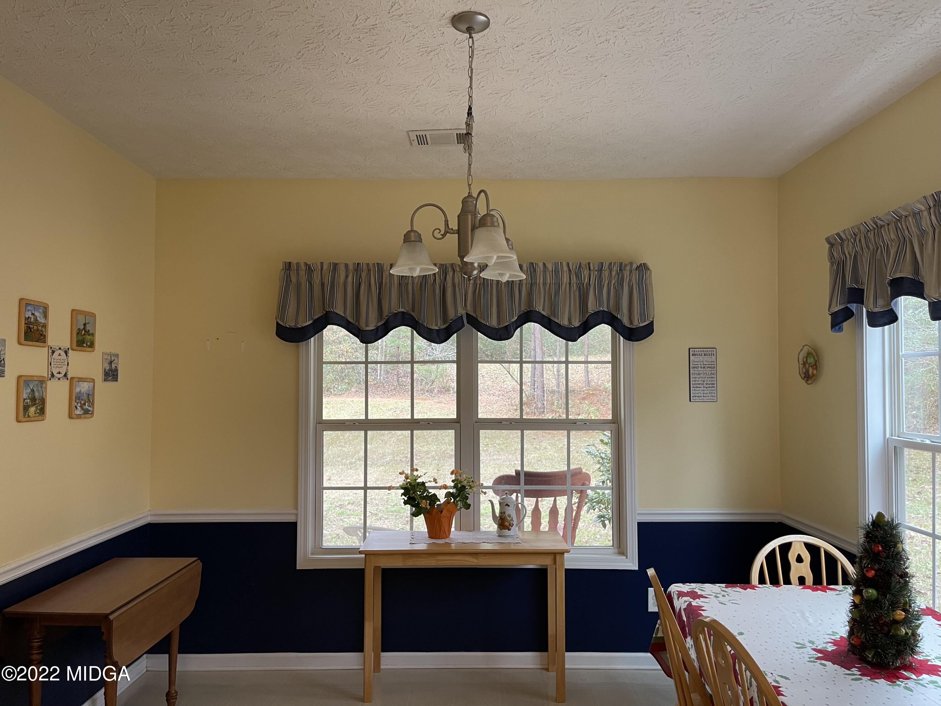 90 Hickory Road Jackson, GA 30233 - Photo 6 of 19 a room with furniture and window