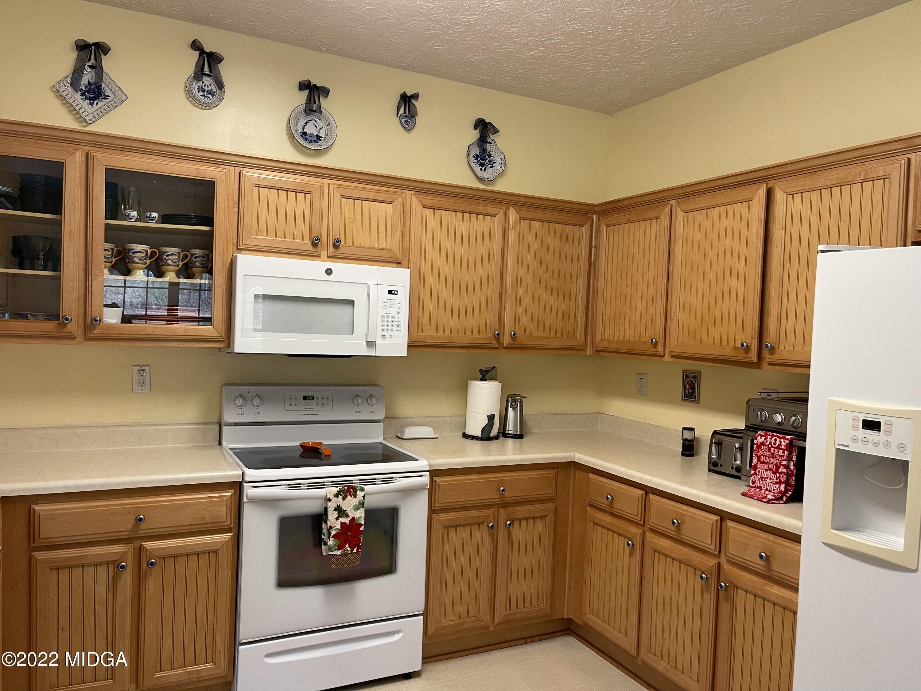90 Hickory Road Jackson, GA 30233 - Photo 8 of 19 a kitchen with stainless steel appliances granite countertop a sink and cabinets