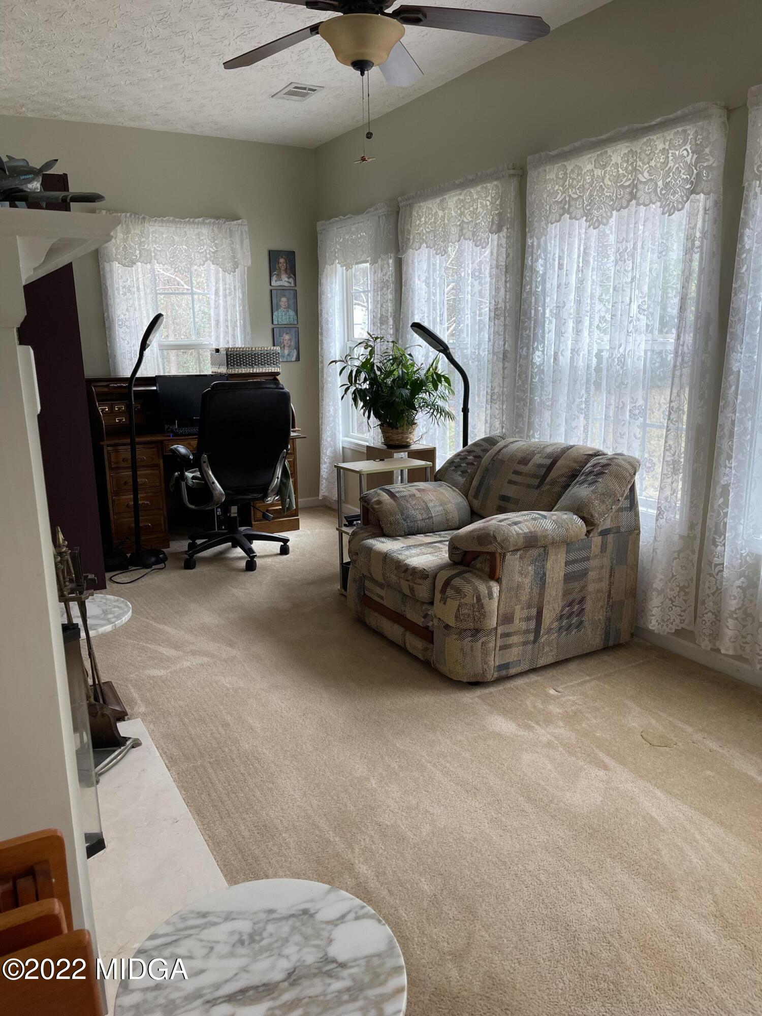 90 Hickory Road Jackson, GA 30233 - Photo 10 of 19 a living room with furniture and a piano