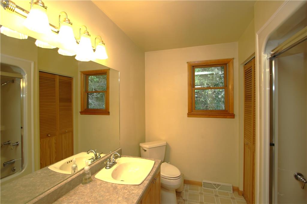 796 Rte 481 Monongahela, PA 15063 - Photo 10 of 26 Vanity Lights & Large Mirror in Big Bathroom w/ Shelved Linen Closet. Attractive Tub Surround w/ Glass Doors