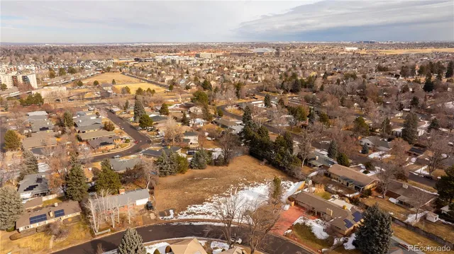an aerial view of residential building and parking space
