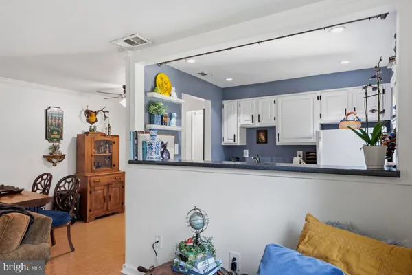 a kitchen with stainless steel appliances a sink a stove and a refrigerator