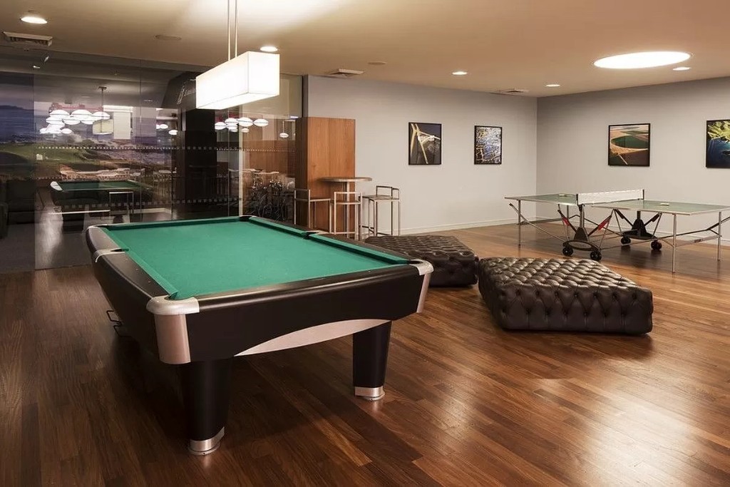 60 Riverside Boulevard, Unit 1707 Manhattan, NY 10069 - Photo 14 of 20 a room with pool table windows and wooden floor
