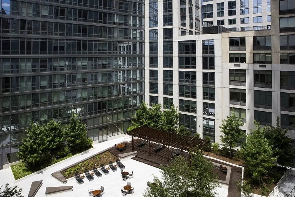 60 Riverside Boulevard, Unit 1707 Manhattan, NY 10069 - Photo 16 of 20 a view of a backyard with plants