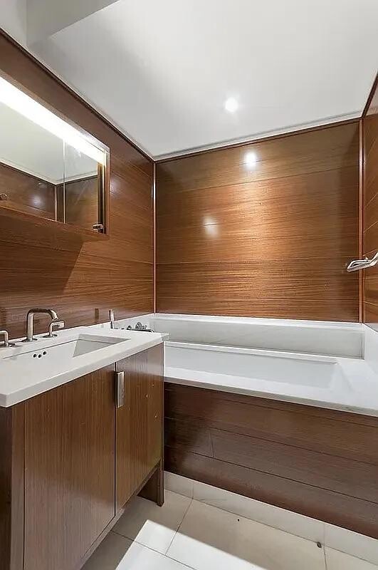 60 Riverside Boulevard, Unit 1707 Manhattan, NY 10069 - Photo 9 of 20 a bathroom with a sink and a mirror