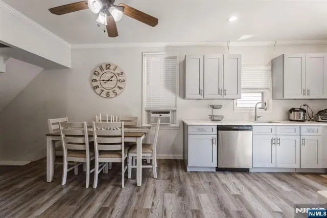a kitchen with a table chairs and a stove