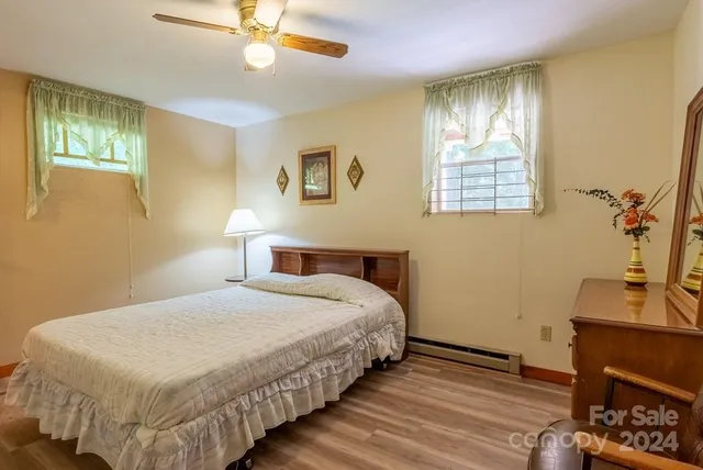 a view of a dining room with furniture and a window