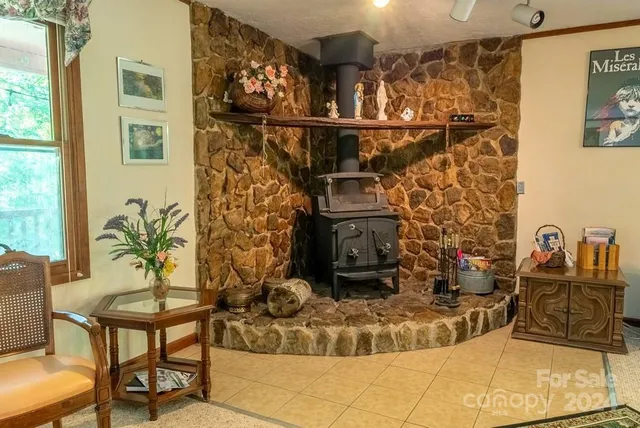 a bathroom with a sink a toilet and shower curtain