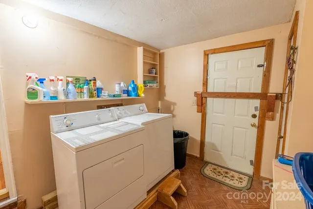 a view of a lush green field with lots of bushes