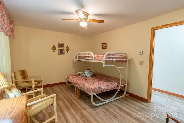 a bed room with a bed and a chandelier